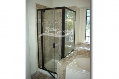 3 Semi-frameless corner enclosure with a swinging door,an inline & return panel & a full structure frame CLEAR GLASS  OIL RUBBED BRONZE HARDWARE 393